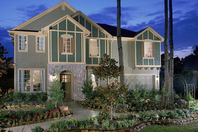Large traditional green two-story concrete fiberboard exterior home idea in Austin