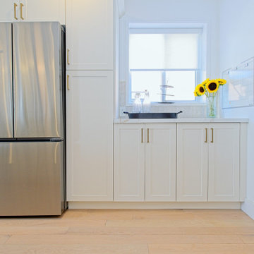 Stainless Refrigerator Beside White Kitchen Window Cabinets | The Junction