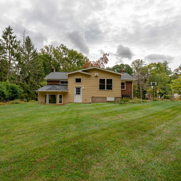 Cheerful Multi Level Rear Addition to Expand Kitchen, Mudroom & Sunroom in Oakt