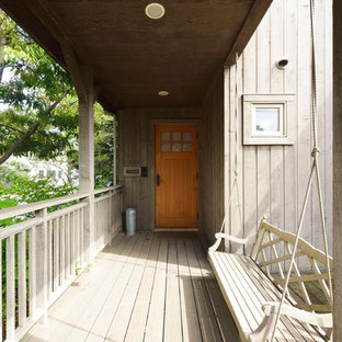 他の地域の大きいカントリー風おしゃれなデッキ (張り出し屋根) の写真