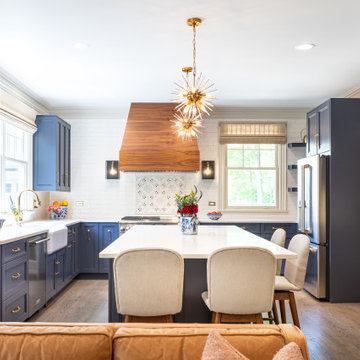 Sophisticated Navy Kitchen with Custom Hood and Brass Accents