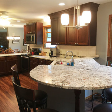 Ginger Snap Maple Cabinets in Updated Kitchen with Peninsula Seating