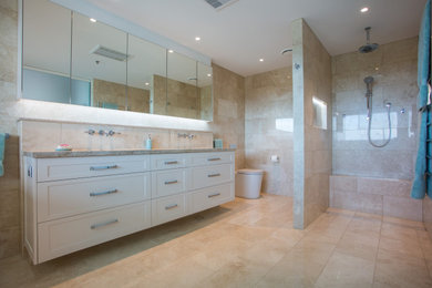 Inspiration for an expansive modern master bathroom in Brisbane with shaker cabinets, beige cabinets, a freestanding tub, an open shower, brown tile, marble, quartzite benchtops, brown benchtops, a double vanity and a floating vanity.