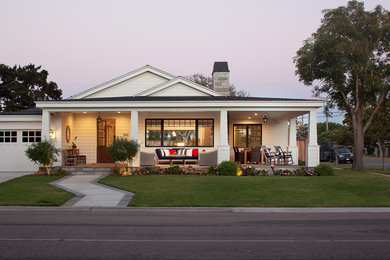This is an example of a mid-sized country one-storey white exterior in San Diego with wood siding.