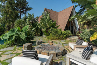 Example of an island style home design design in Sacramento