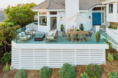 Photo of a mid-sized coastal landscaping in Orange County with decking.