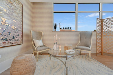 Large transitional open concept laminate floor and beige floor living room photo in Chicago with pink walls, a hanging fireplace and a wall-mounted tv