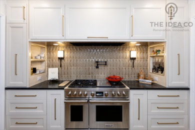 Inspiration for a mid-sized transitional galley light wood floor and brown floor kitchen pantry remodel in Other with a single-bowl sink, recessed-panel cabinets, white cabinets, quartzite countertops, multicolored backsplash, ceramic backsplash, stainless steel appliances, an island and white countertops