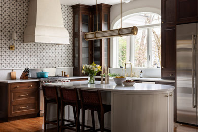 Example of a large classic l-shaped dark wood floor and brown floor enclosed kitchen design in New York with a single-bowl sink, beaded inset cabinets, dark wood cabinets, quartz countertops, multicolored backsplash, ceramic backsplash, stainless steel appliances, an island and white countertops