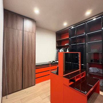 Luxury Walk-In Closet – Glass Display Wardrobe & Accent Orange Makeup Vanity