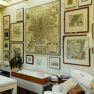 Shabby-chic style home office and library in Seattle with white walls and dark hardwood flooring.