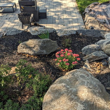 Waterfront backyard landscaping and sunroom extension