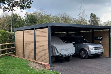 This is an example of a medium sized modern detached double carport in Buckinghamshire.