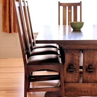 This is an example of a mid-sized arts and crafts open plan dining in Salt Lake City with beige walls, dark hardwood floors, no fireplace and brown floor.