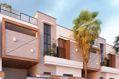 Large modern exterior home idea in Other