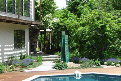 This is an example of a contemporary backyard garden in Baltimore with decking.