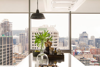 Example of a trendy kitchen design in Montreal with an island