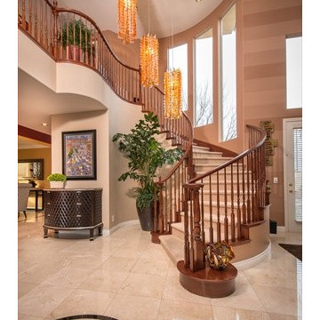 This dramatic staircase begged for dramatic lighting.  It wasn't easy but is now