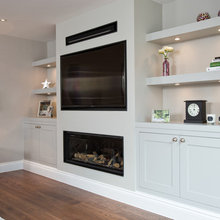 cabinet + shelving framing fireplace