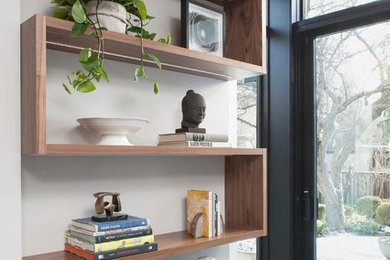 Example of a large trendy open concept family room design in Toronto with white walls