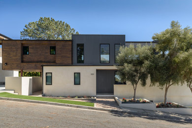Example of a mid-sized trendy multicolored three-story mixed siding exterior home design in San Diego