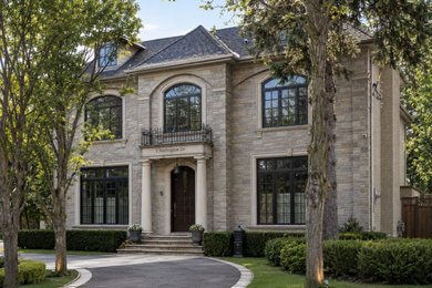 Example of a huge trendy beige two-story mixed siding exterior home design in Toronto with a shingle roof and a black roof