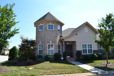 Example of a transitional home design design in Raleigh