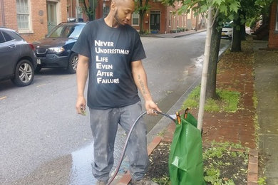 Photo of a small traditional full sun front yard mulch garden path in Baltimore.