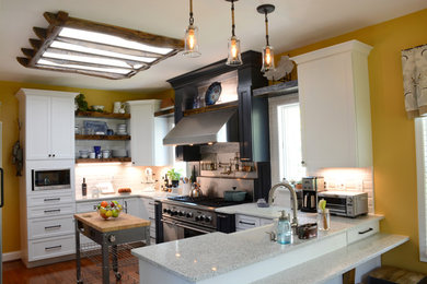 Inspiration for a mid-sized cottage u-shaped dark wood floor and brown floor eat-in kitchen remodel in Other with a farmhouse sink, shaker cabinets, white cabinets, quartzite countertops, white backsplash, subway tile backsplash, stainless steel appliances and an island