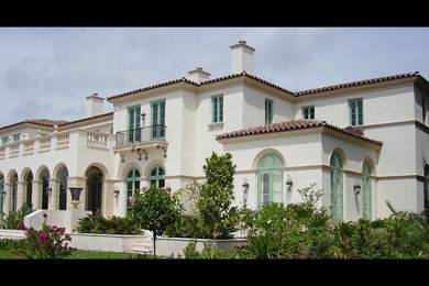 Inspiration for a mediterranean white two-story exterior home remodel in Miami