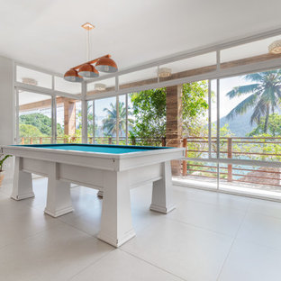 Example of an island style family room design in Miami