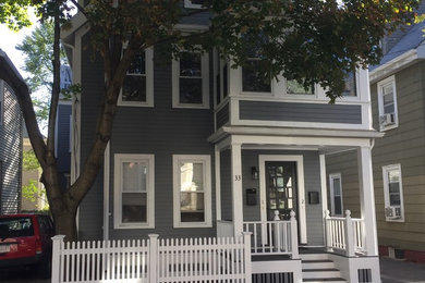 Mid-sized elegant gray two-story wood exterior home photo in Boston