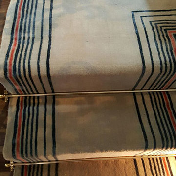 Beige Carpet Installation With Some Stripes to Stairs