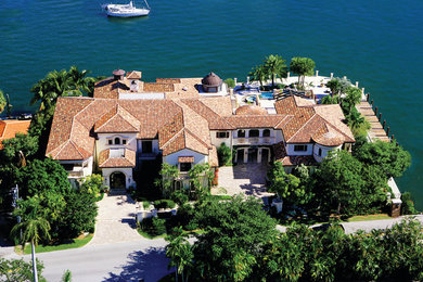 Example of a tuscan exterior home design in Miami