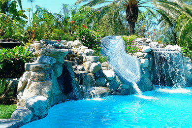Island style pool photo in San Diego