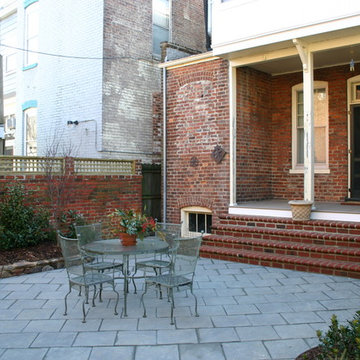 Urban Garden with Brick Walls and Large Pavers