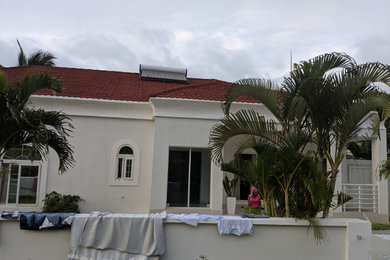Example of a mid-sized tuscan home design design in Other