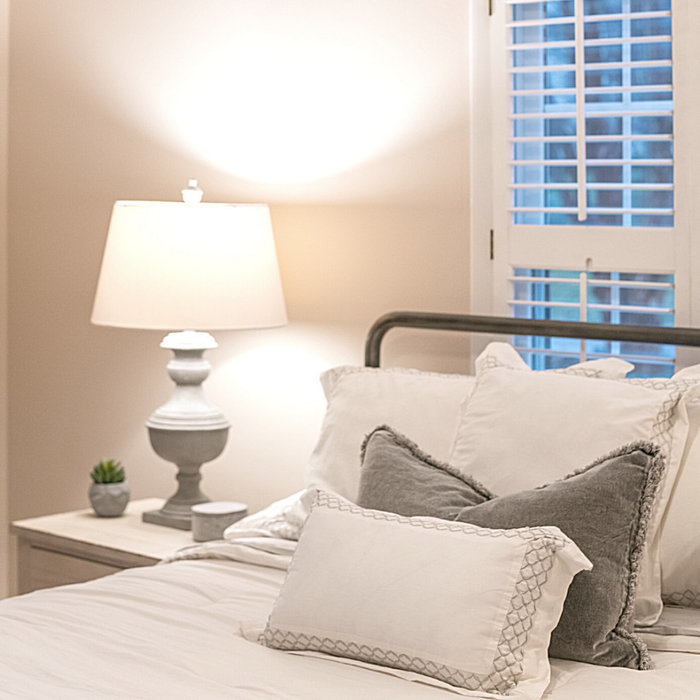 I love using metal beds in small spaces.  This room is so charming.