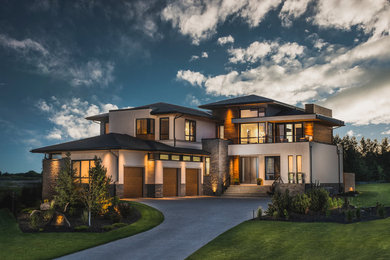 Example of a transitional exterior home design in Calgary