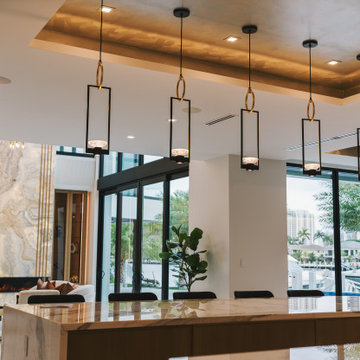 Elevated Dining Experience: Kitchen Island Pendants and Tray Ceiling Finish
