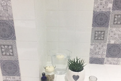 Small contemporary bathroom in Other with a built-in bath, a shower/bath combination, white tiles and ceramic tiles.