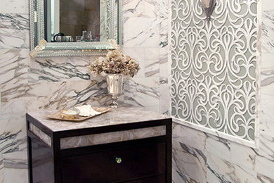 Mosaic tile marble floor powder room photo in Miami