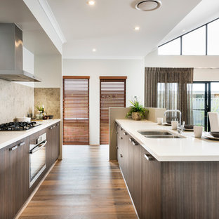 Mid-sized contemporary kitchen pantry inspiration - Example of a mid-sized trendy galley vinyl floor kitchen pantry design in Perth with an undermount sink, flat-panel cabinets, medium tone wood cabinets, beige backsplash, stainless steel appliances and an island