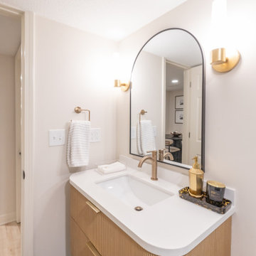 Warm & Inviting Basement Retreat with Custom Bar + Entertainment Center