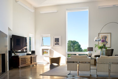 Trendy living room photo in Albuquerque with white walls and a wall-mounted tv