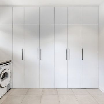 Sleek and Timeless Laundry and Bathroom Cabinetry