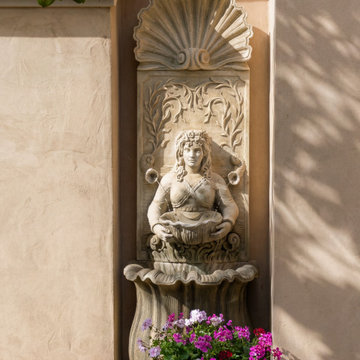 Classical wall fountain detail in Pebble Beach courtyard