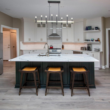 3 Finishes on Kitchen Cabinetry with Galley Workstation in Island and Wine Bar
