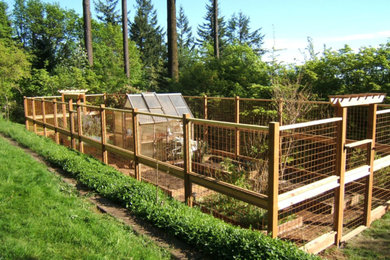 Inspiration for a large transitional backyard vegetable garden landscape in Portland.