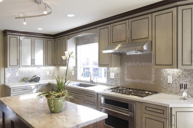 Mid-sized transitional l-shaped medium tone wood floor and brown floor eat-in kitchen photo in San Francisco with an undermount sink, raised-panel cabinets, light wood cabinets, quartz countertops, beige backsplash, stainless steel appliances, an island, mosaic tile backsplash and beige countertops